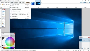 Captura da tela principal do Paint.Net. A imagem de fundo padrão do Windows 10 está carregada no programa que está exibindo várias de suas funcionalidades. Estão sendo exibidas as interfaces de camada, de cores e de ferramentas. Além disso, o menu 